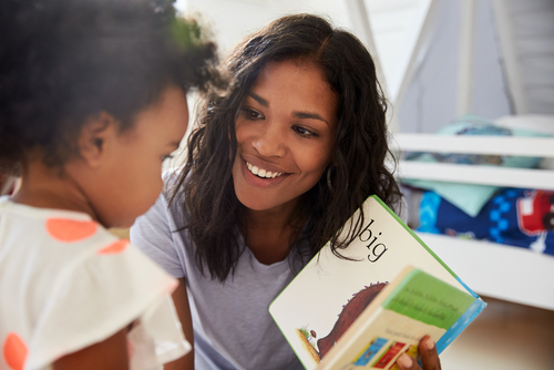 Mother,And,Baby,Daughter,Reading,Book,In,Playroom,Together